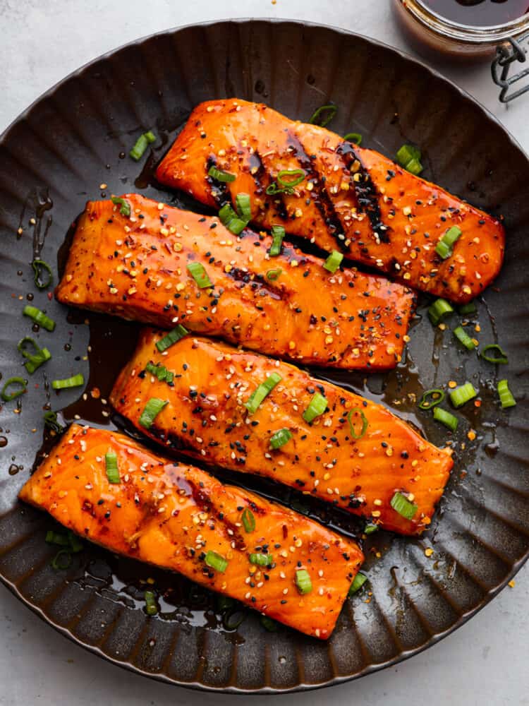 4 salmon filets coated in firecracker sauce.