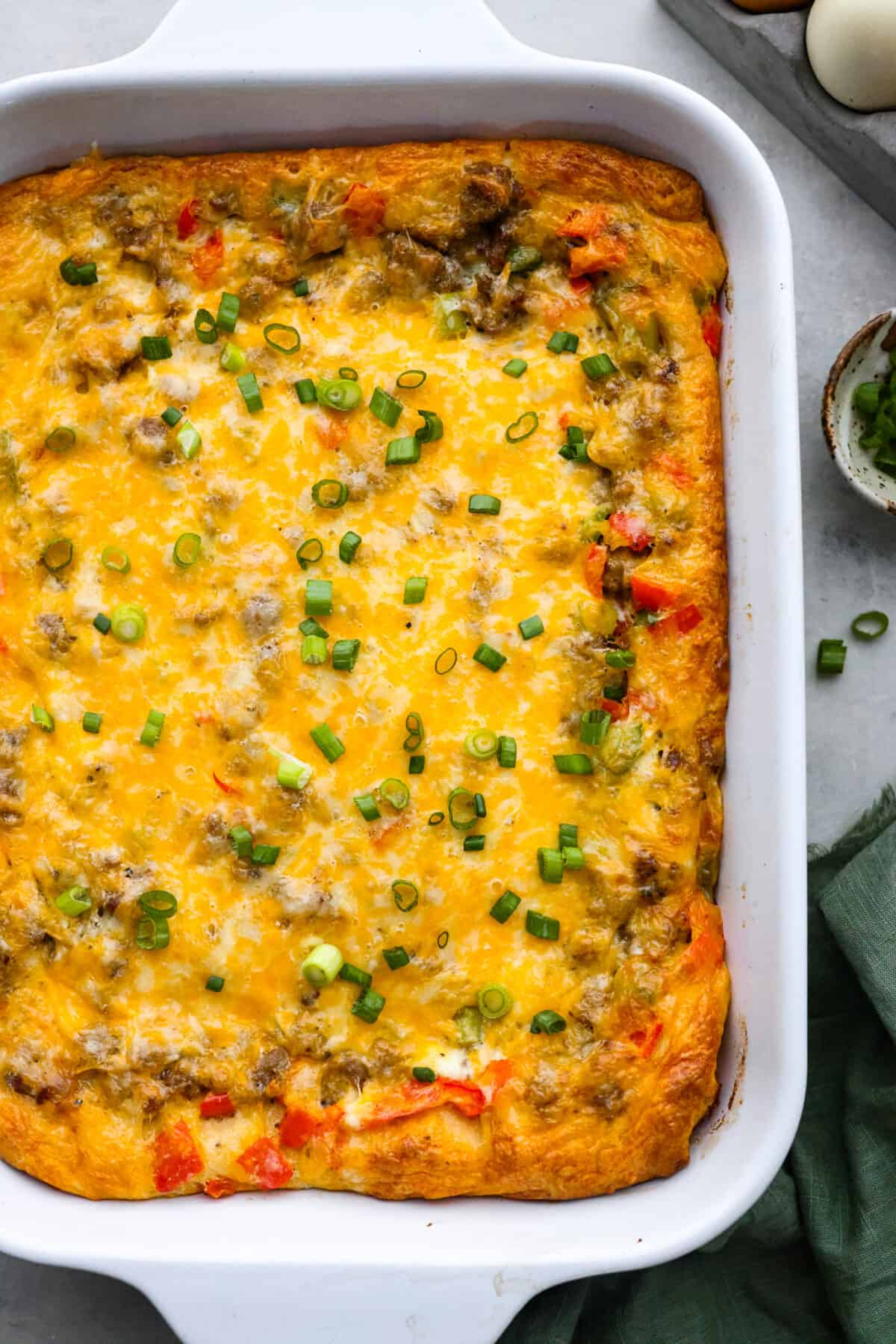 Top-down view of a baked crescent roll breakfast casserole.