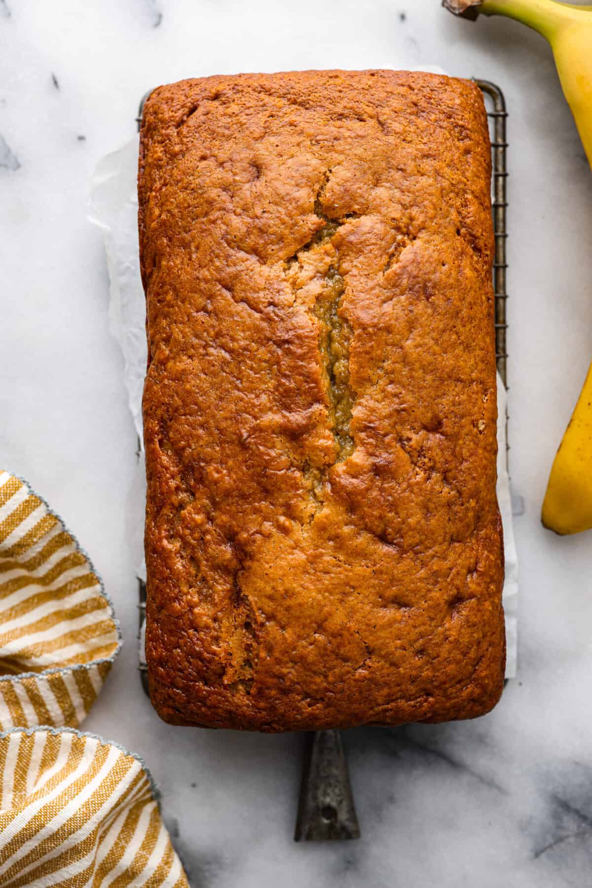 Top-down view of a whole loaf of sour cream banana bread.