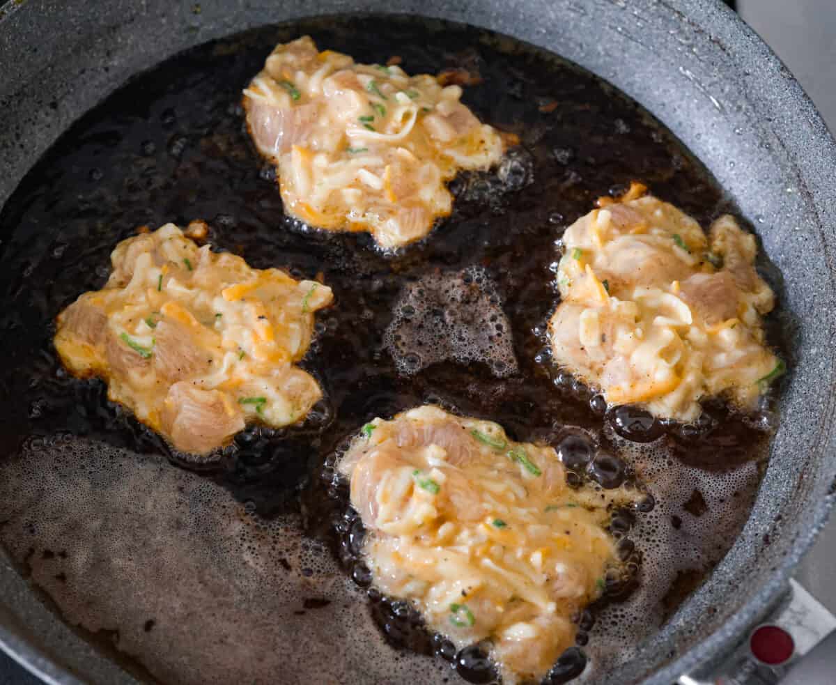 Chicken fritters being fried