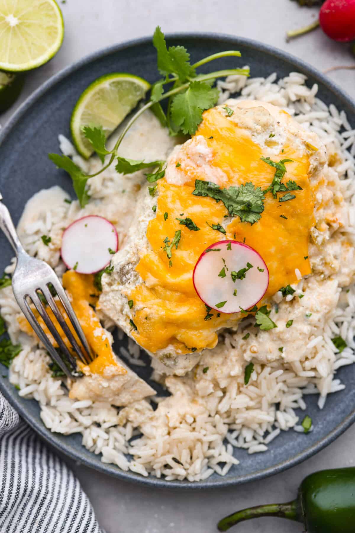 Green chile chicken served over a bed of rice.