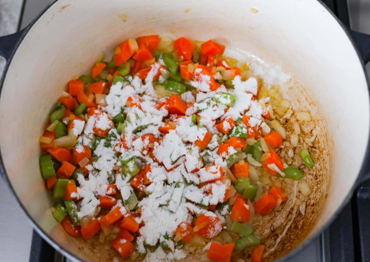 Second process photo of the flour sprinkled over the veggies.