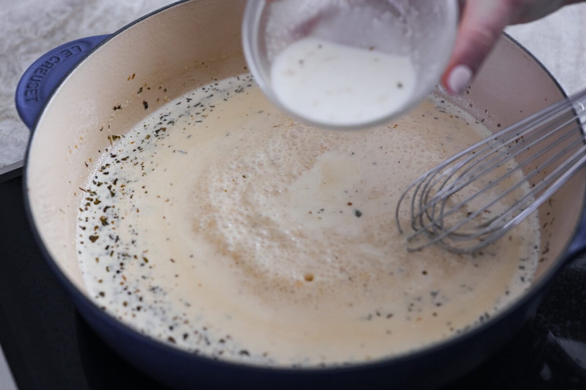 Adding the sauce ingredients to the skillet.