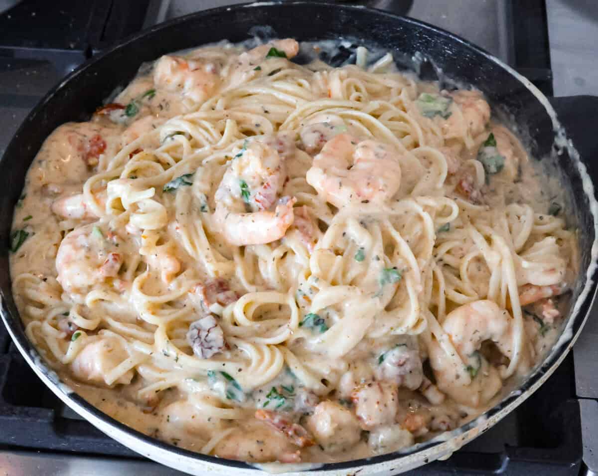 Angle shot of skillet with completed marry me shrimp with pasta. 